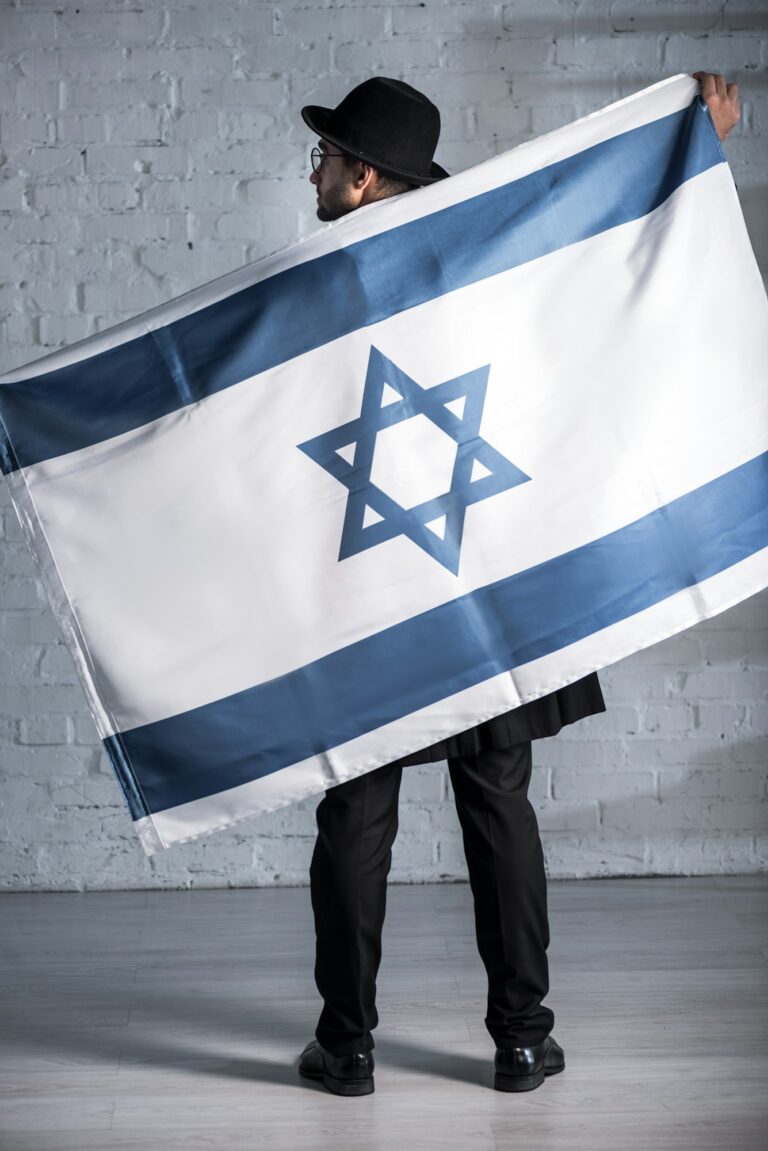 back view of jewish man with flag of israel